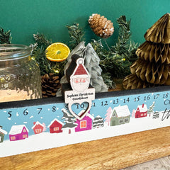 personalised-christmas-advent-slider-snowy-houses-with-surname|LLUVADVENTD4|Luck and Luck| 1