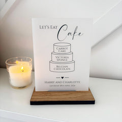 Elegant Black Personalised Wedding Cake Sign - Opaque Acrylic with Rustic Wooden Base for Customising Your Special Day